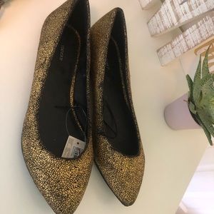 Gold and black flats